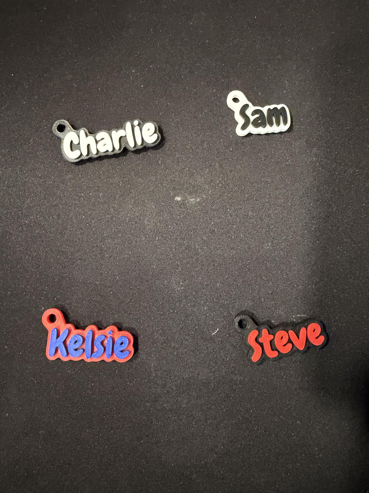 Personalized name keychains in assorted color combinations