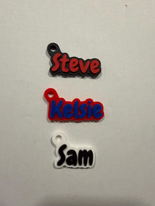 Two-tone 3D printed name keychain with raised lettering and metal split ring