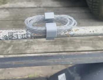Two color options of the 3D printed trimmer line holder shown side by side; one holder included per order